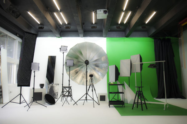 Green screen studio set of light and photo equipment with backdrops