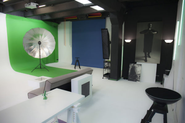 Photo studio Interiors with furniture and equipment of green blue backdrops and lights